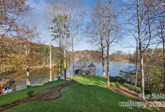 Lake view with gazebo and trees.